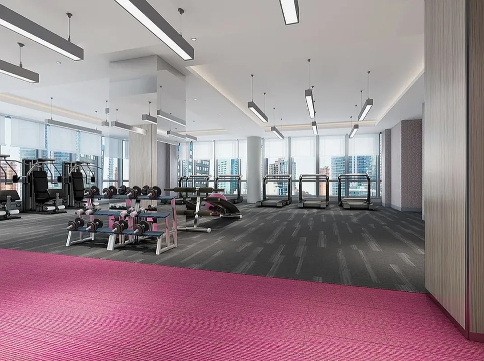 27-17 42nd Road, Unit 15F Queens, NY 11101 - Photo 8 of 11 a view of a room with gym equipment