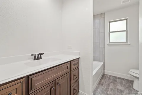 a bathroom with a sink and a toilet