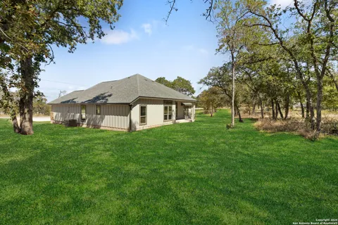 a view of a house with a big yard