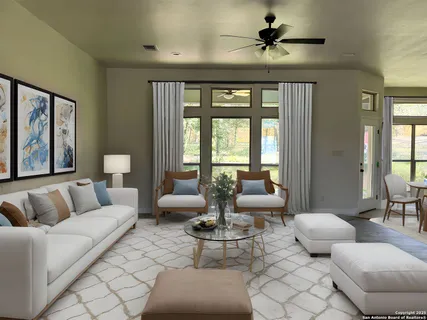 a living room with fireplace furniture and a large window