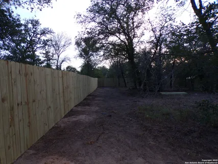 a view of backyard with green space