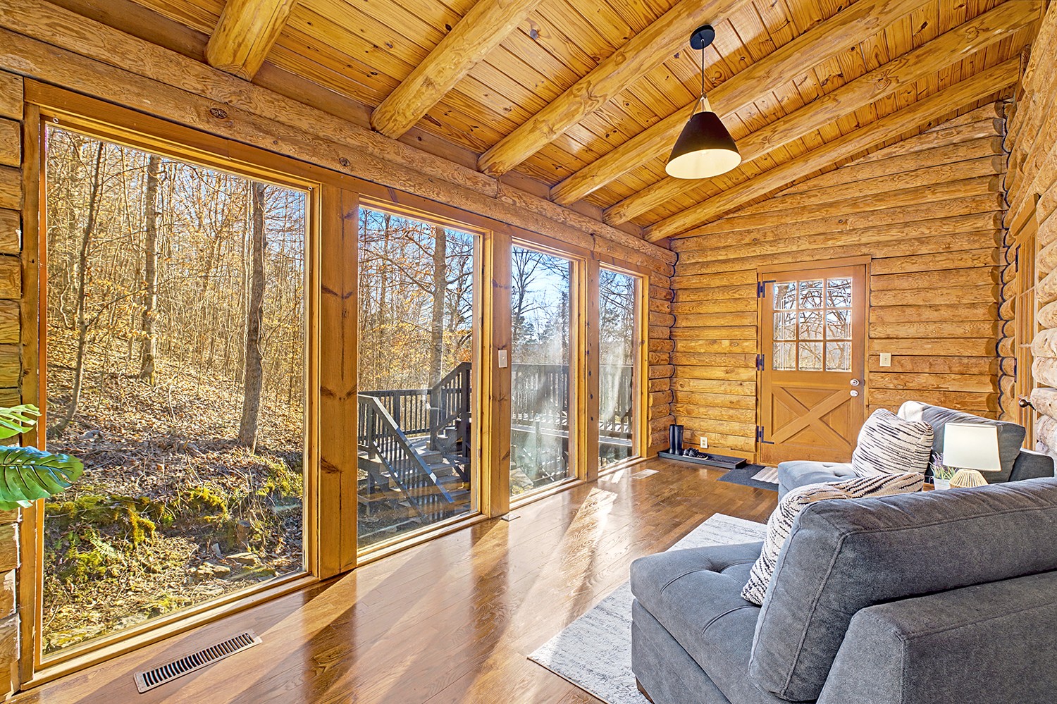a bedroom with furniture and large windows