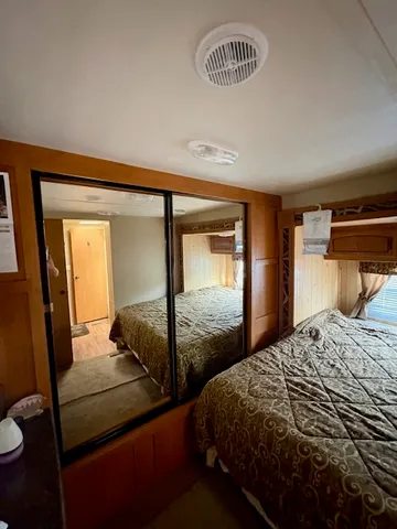 a bedroom with double bed and a window