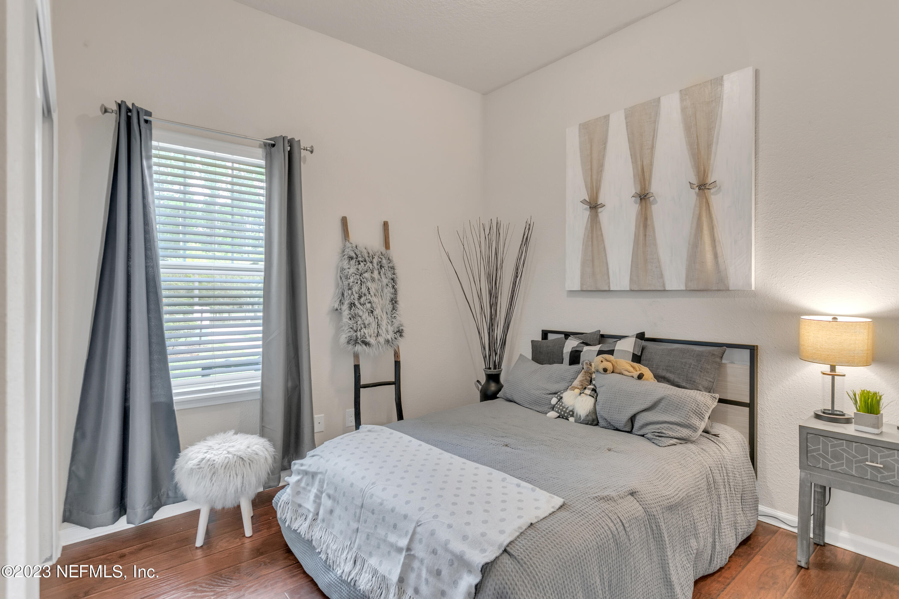 200 Larkin Place, Unit 101 St. Johns, FL 32259 - Photo 12 of 29 a bedroom with a bed and a window