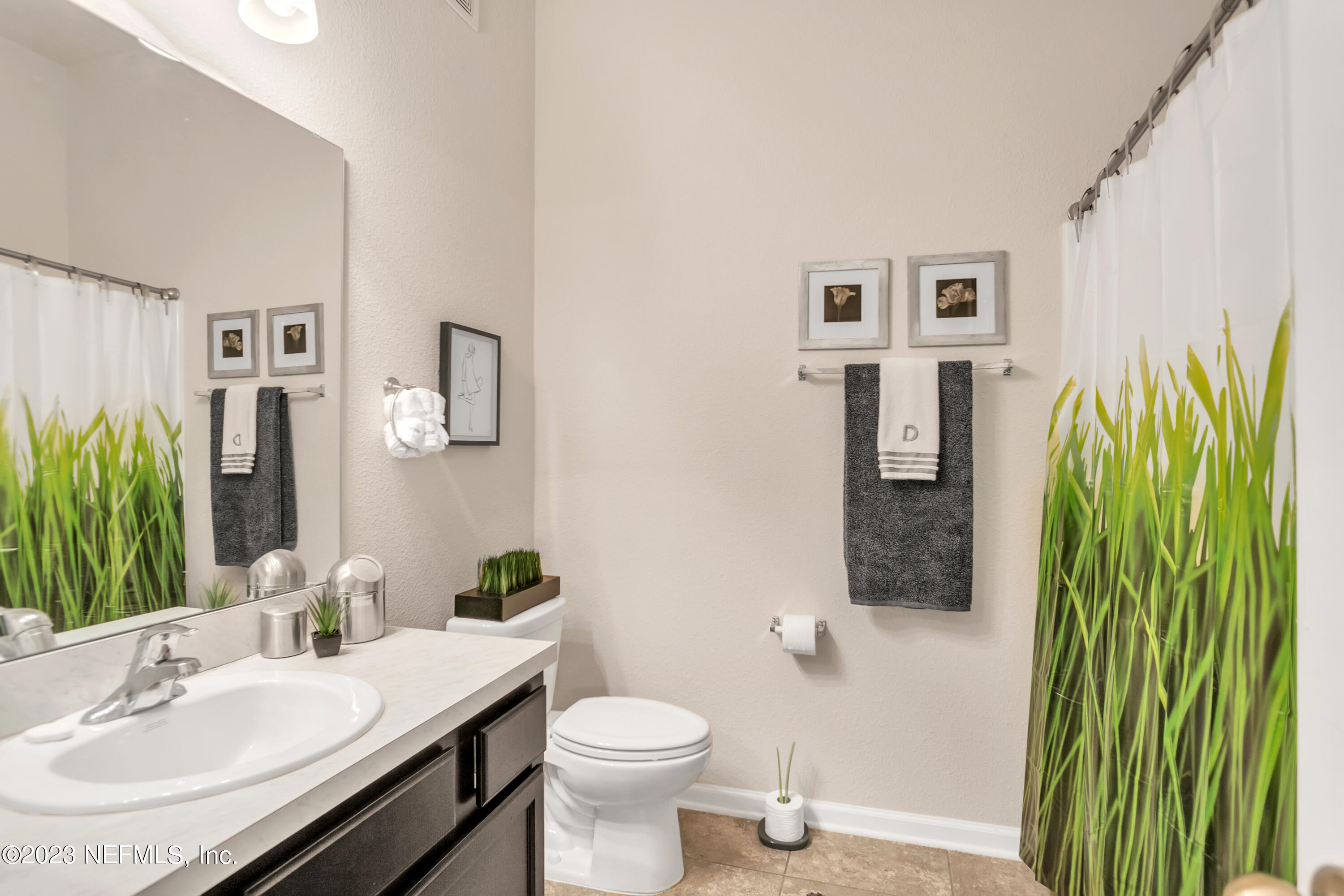 200 Larkin Place, Unit 101 St. Johns, FL 32259 - Photo 14 of 29 a bathroom with a sink a toilet and shower