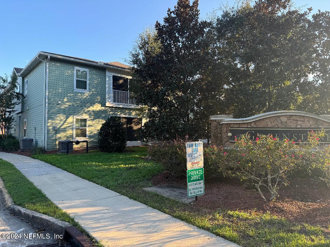 200 Larkin Place, Unit 101 St. Johns, FL 32259 - Photo 24 of 29 a front view of a house with a garden