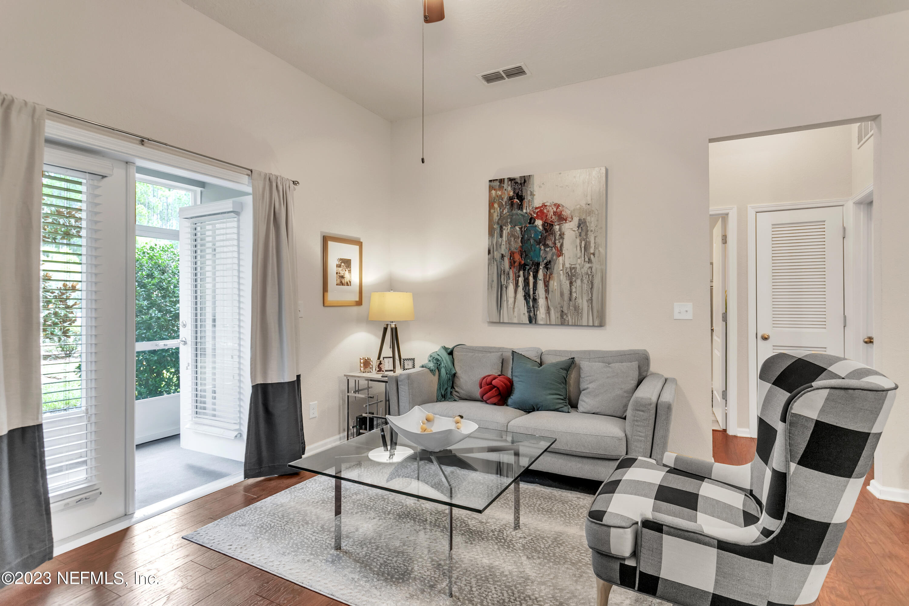 200 Larkin Place, Unit 101 St. Johns, FL 32259 - Photo 5 of 29 a living room with furniture and wooden floor