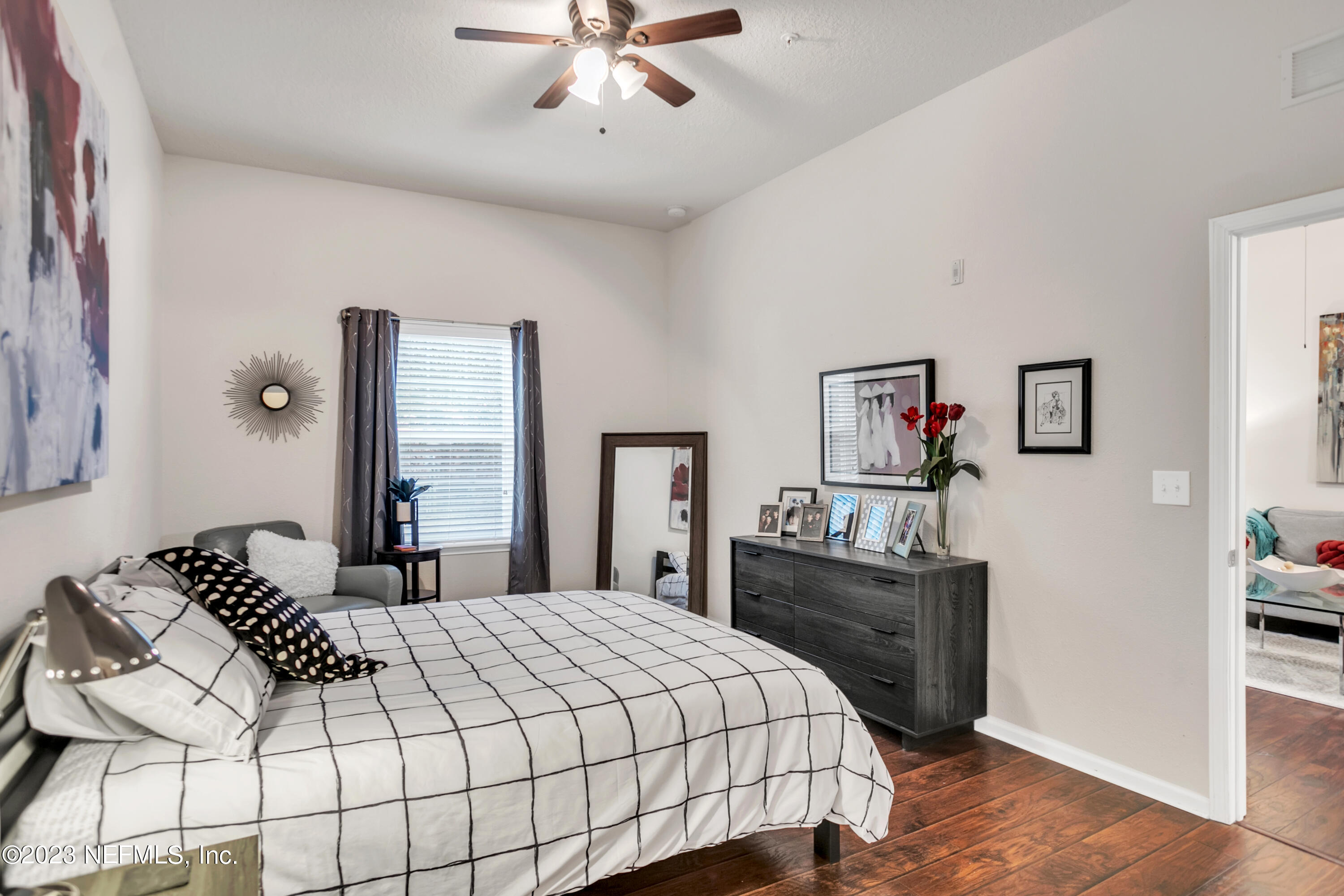 200 Larkin Place, Unit 101 St. Johns, FL 32259 - Photo 8 of 29 a bedroom with a bed and dresser