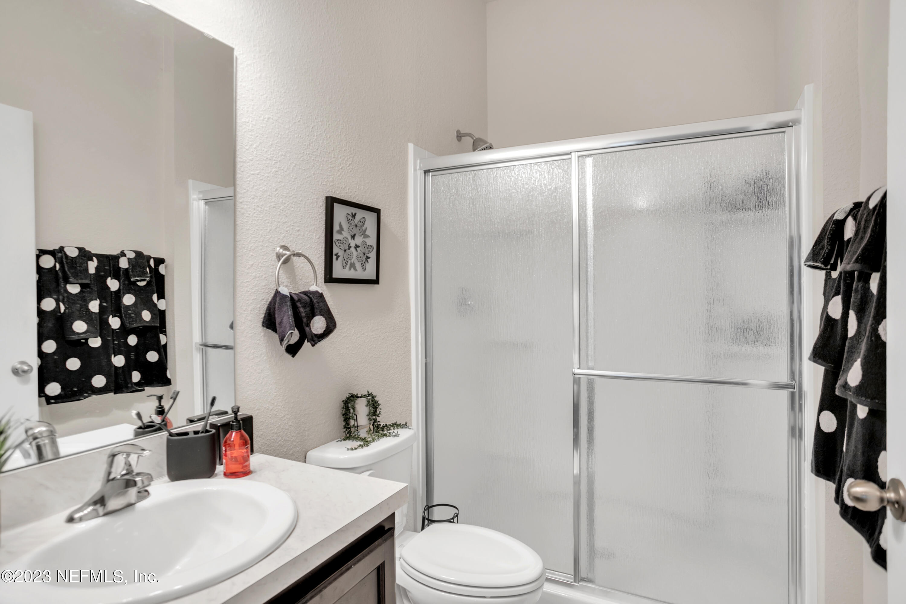 200 Larkin Place, Unit 101 St. Johns, FL 32259 - Photo 9 of 29 a bathroom with a sink toilet and shower