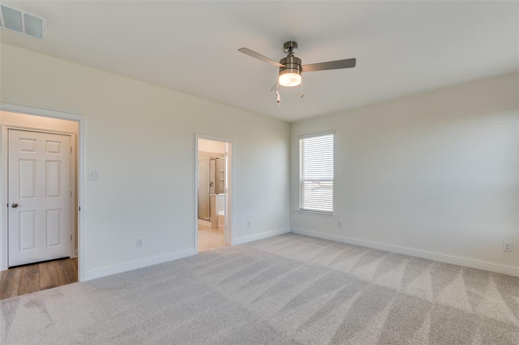 341 Fallbrook Drive Aledo, TX 76008 - Photo 12 of 40 Spare room featuring light colored carpet and ceiling fan