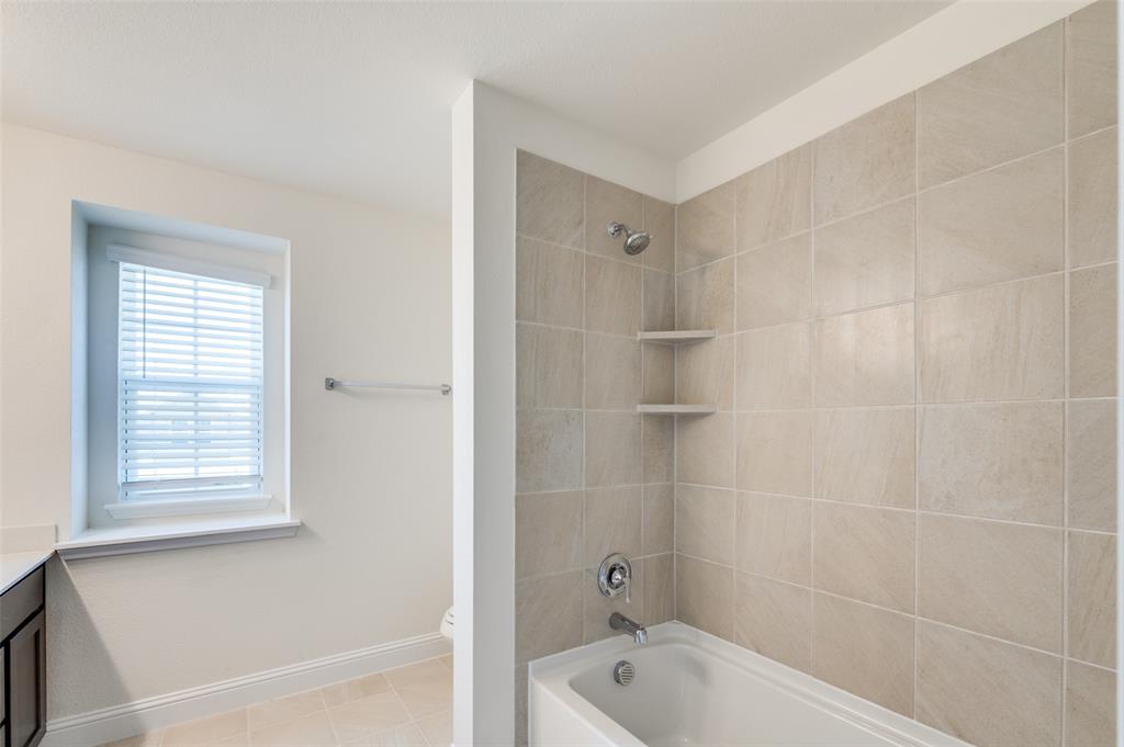 341 Fallbrook Drive Aledo, TX 76008 - Photo 21 of 40 Bathroom with vanity, shower / tub combination, and tile patterned floors