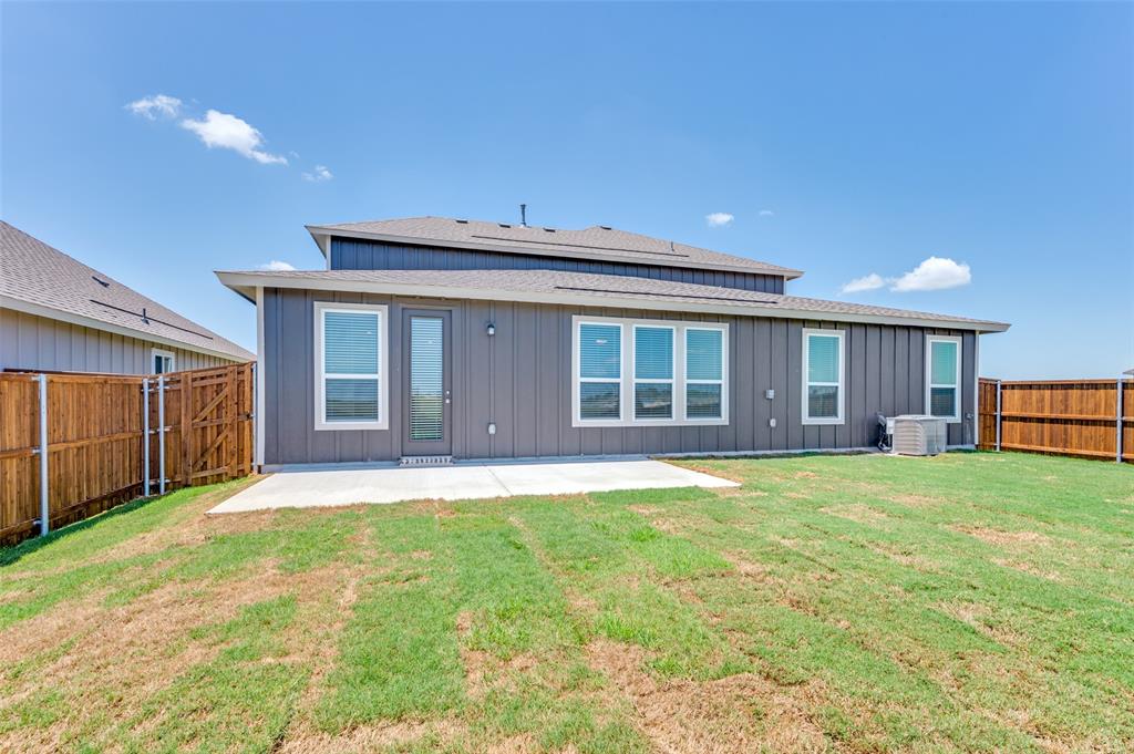 341 Fallbrook Drive Aledo, TX 76008 - Photo 25 of 40 Back of house featuring a patio area, a fenced backyard, board and batten siding, and roof with shingles
