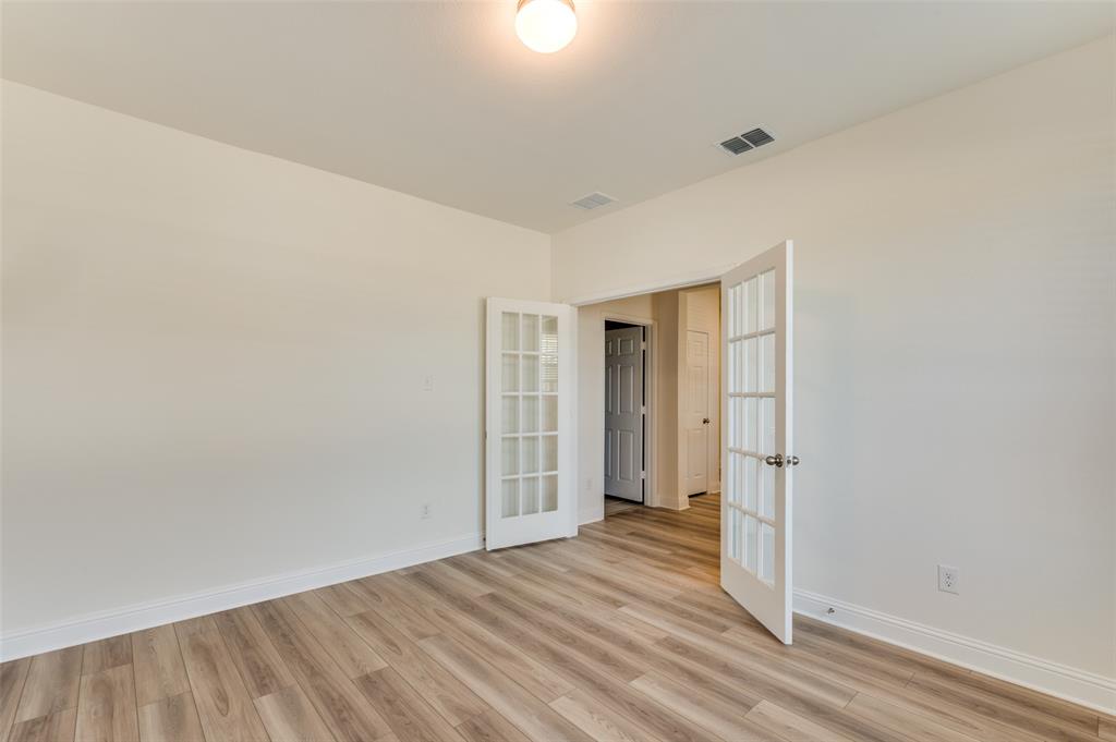 341 Fallbrook Drive Aledo, TX 76008 - Photo 5 of 40 Unfurnished room featuring french doors and light wood-style floors