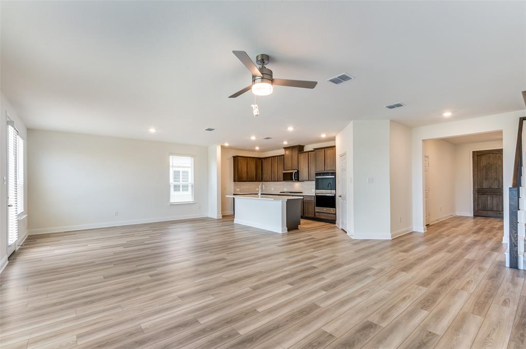 341 Fallbrook Drive Aledo, TX 76008 - Photo 8 of 40 Unfurnished living room with recessed lighting, a ceiling fan, and light wood-style flooring