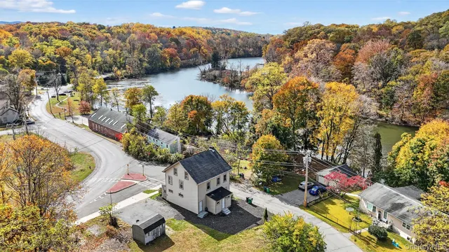an aerial view of a house with a lake view