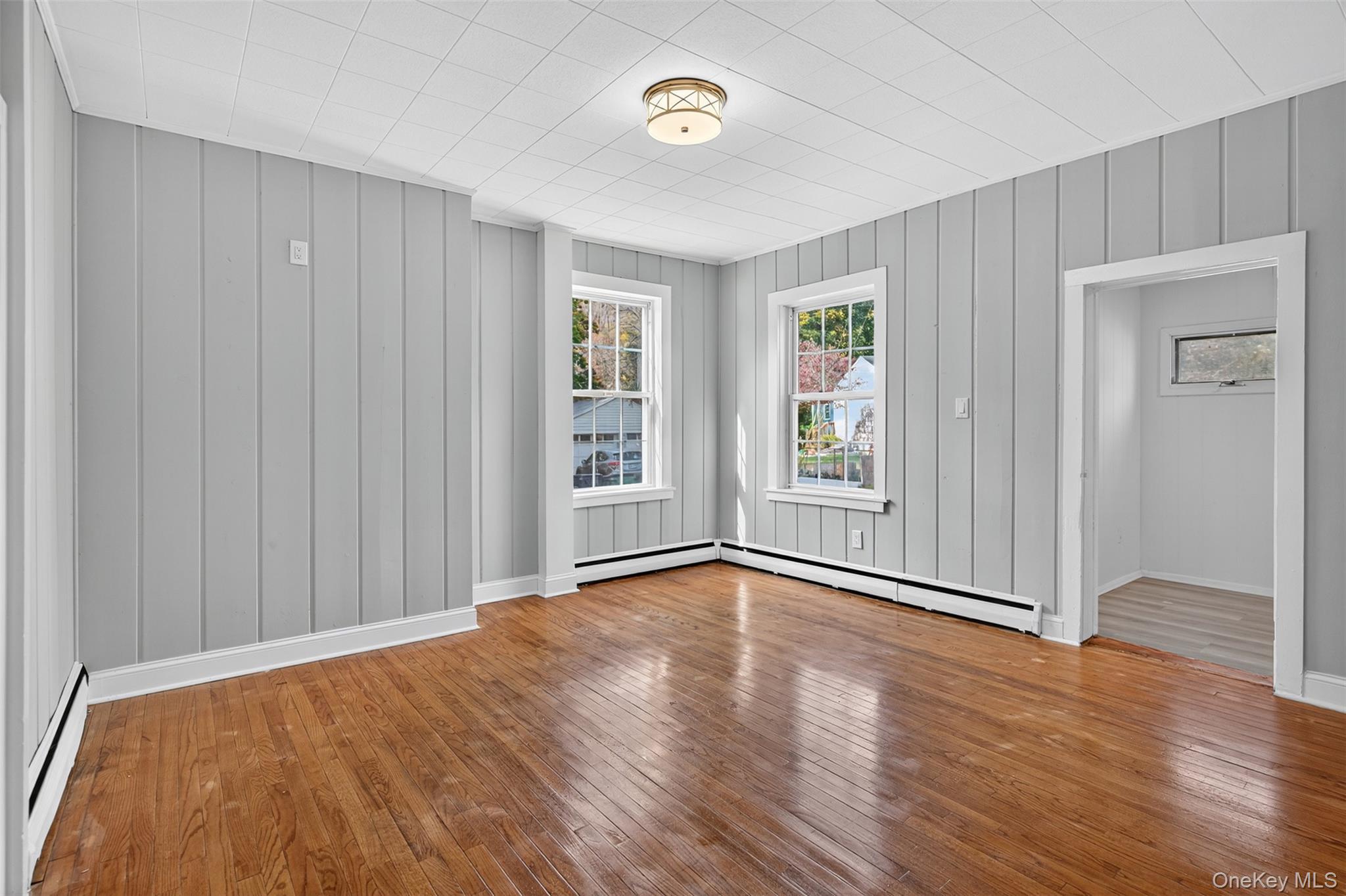 95 Market Street Wappingers Falls, NY 12590 - Photo 12 of 15 a view of an empty room with wooden floor and a window