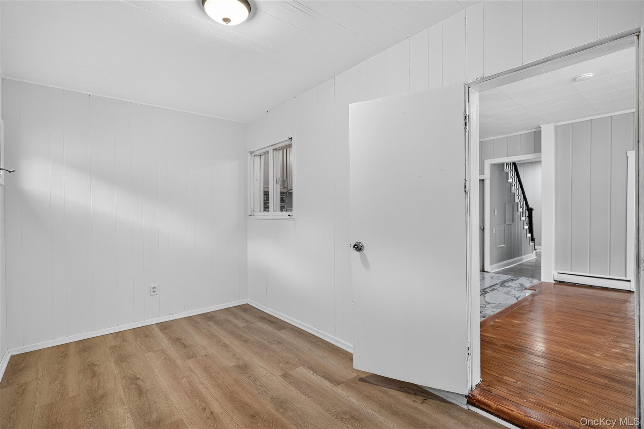 95 Market Street Wappingers Falls, NY 12590 - Photo 13 of 15 an empty room with wooden floor and entrance