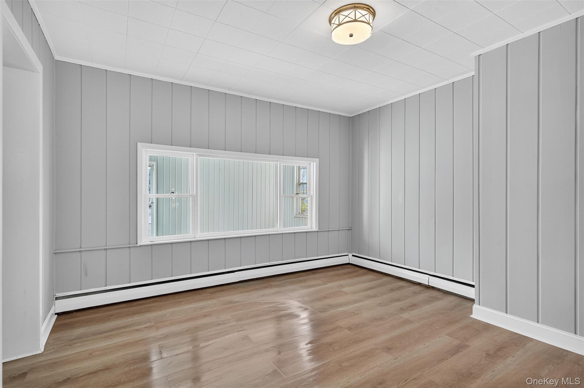 95 Market Street Wappingers Falls, NY 12590 - Photo 6 of 15 a view of an empty room with wooden floor and a window