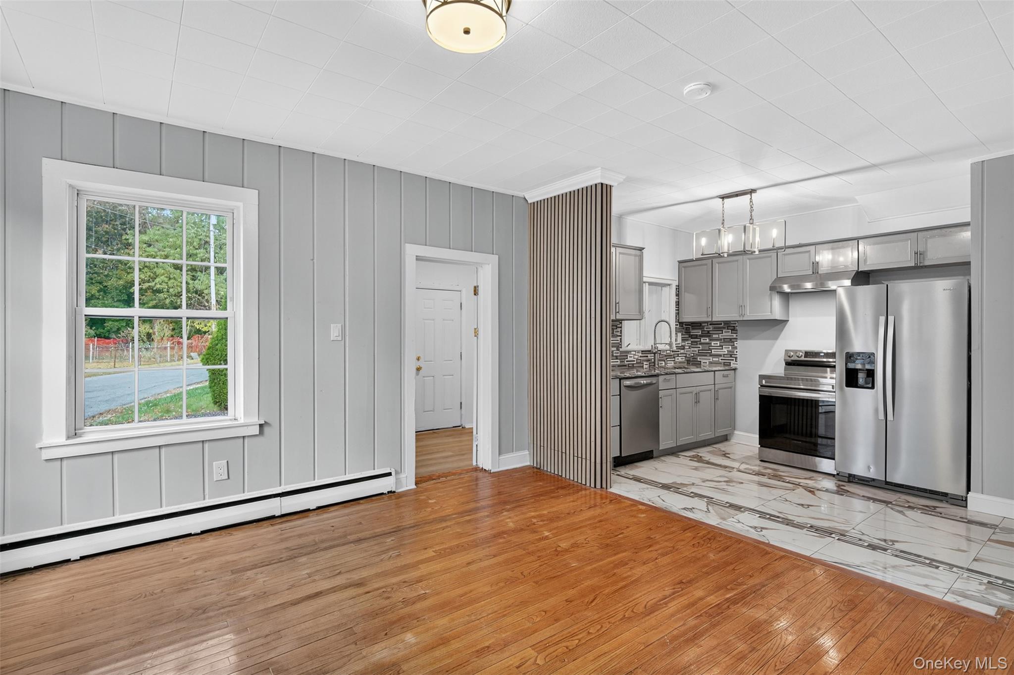 95 Market Street Wappingers Falls, NY 12590 - Photo 10 of 15 a kitchen with white cabinets and stainless steel appliances