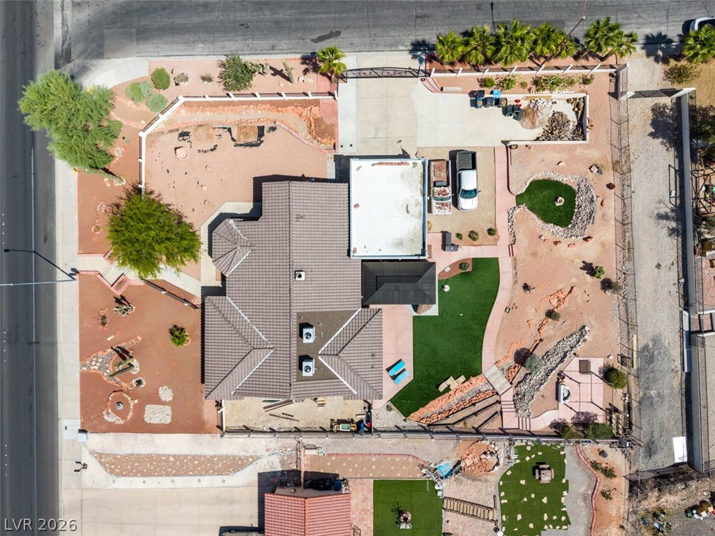892 North Hollywood Boulevard Las Vegas, NV 89110 - Photo 2 of 81 This expansive property features a tile roof, paved driveway, and varied landscaping for comfortable outdoor living.