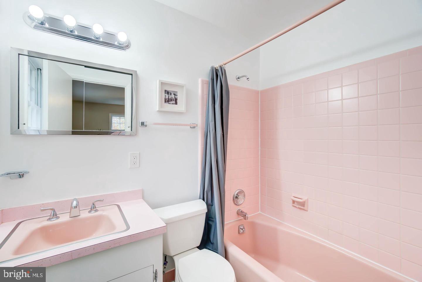 11207 Emack Road Beltsville, MD 20705 - Photo 20 of 43 Charming retro pink bathroom oasis.