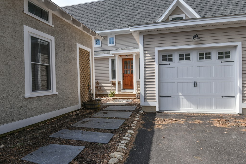 32 North Prospect Street, Unit 4 Amherst, MA 01002 - Photo 1 of 29 a front view of a house with a yard