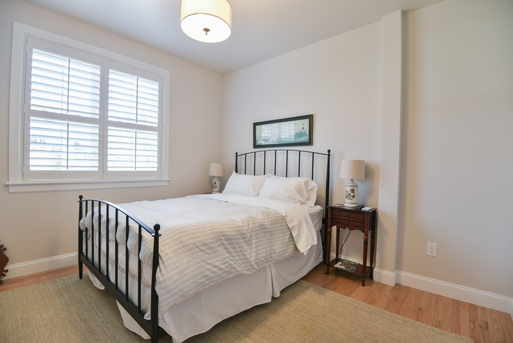 32 North Prospect Street, Unit 4 Amherst, MA 01002 - Photo 13 of 29 a bedroom with a bed and a window
