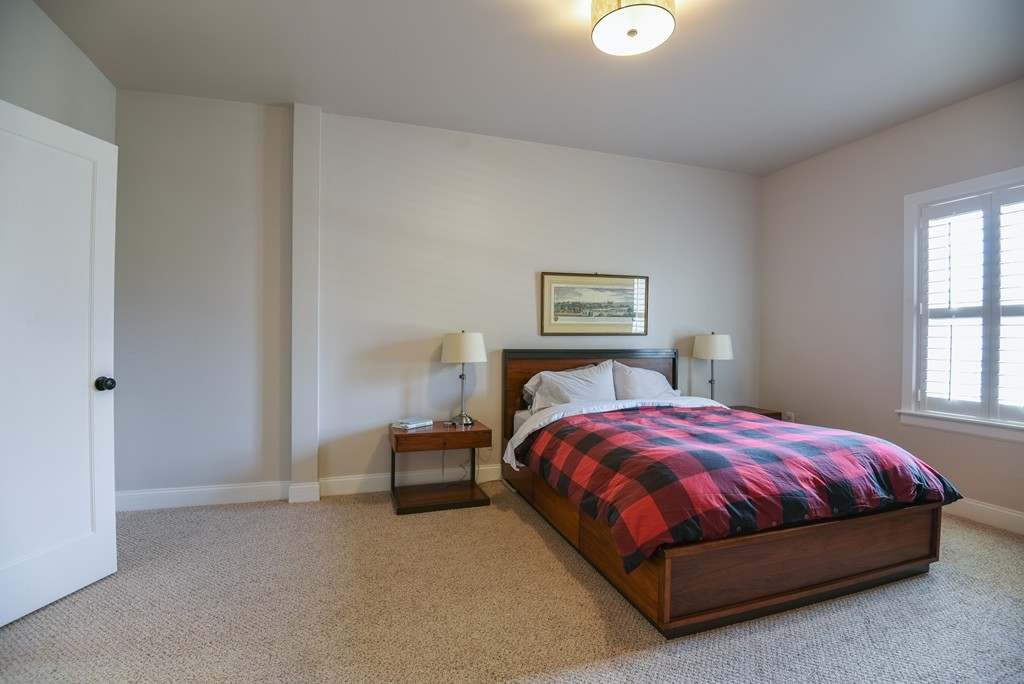 32 North Prospect Street, Unit 4 Amherst, MA 01002 - Photo 17 of 29 a bedroom with a bed and a lamp on dresser