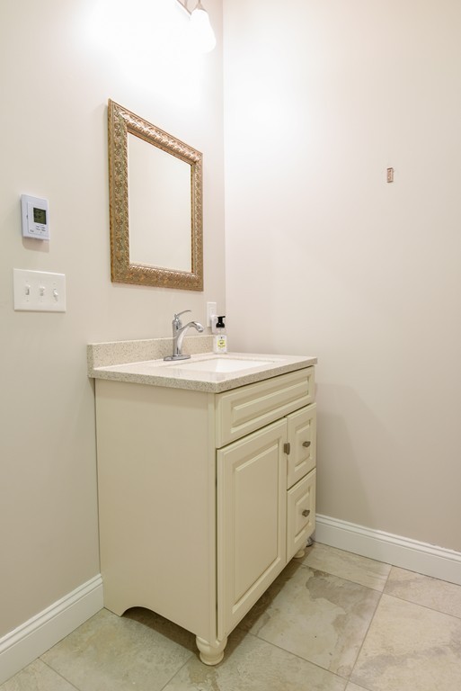 32 North Prospect Street, Unit 4 Amherst, MA 01002 - Photo 23 of 29 a bathroom with a sink and a mirror
