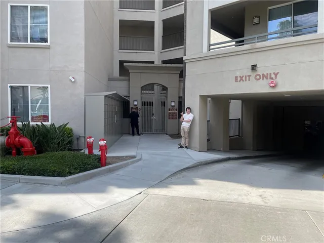 a front view of a building with flowers