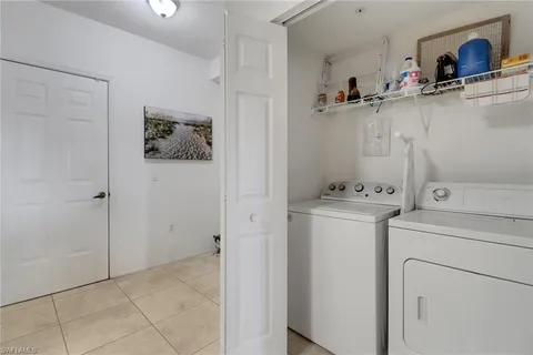 a view of storage and utility room with washer and dryer