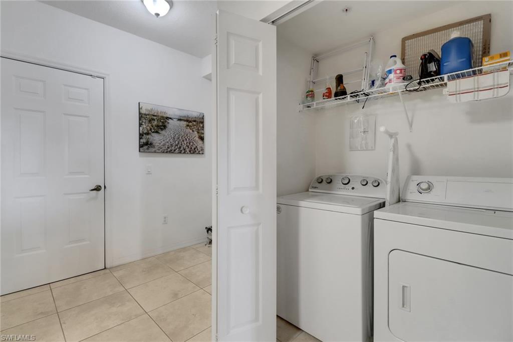 20230 Estero Gardens Circle, Unit 105 Estero, FL 33928 - Photo 21 of 44 a view of storage and utility room with washer and dryer