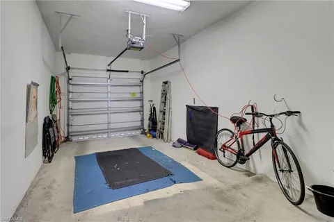 a view of a livingroom with furniture and a bike garage