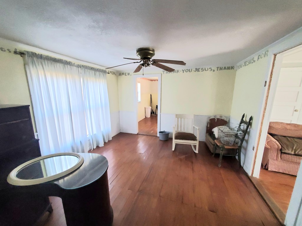 631 Millard Street Mason, TX 76856 - Photo 6 of 16 a living room with furniture and a wooden floor