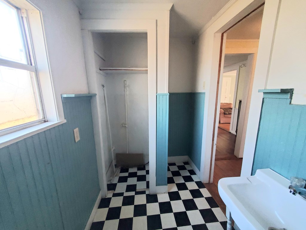 631 Millard Street Mason, TX 76856 - Photo 8 of 16 a bathroom with a black and white checkered floor