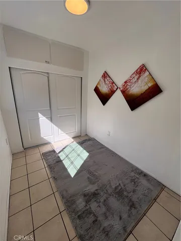 a view of an empty room and wooden floor