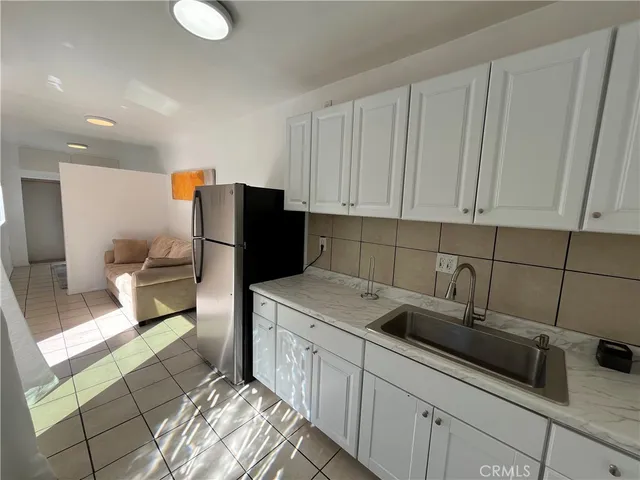 a kitchen with a sink and cabinets