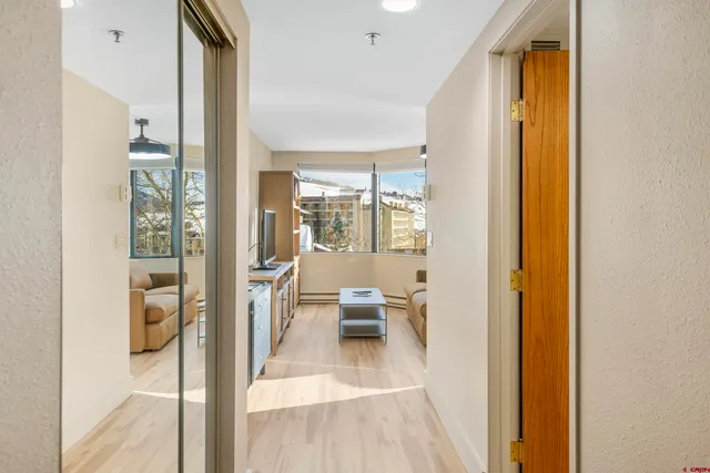 a living room with a furniture and a window