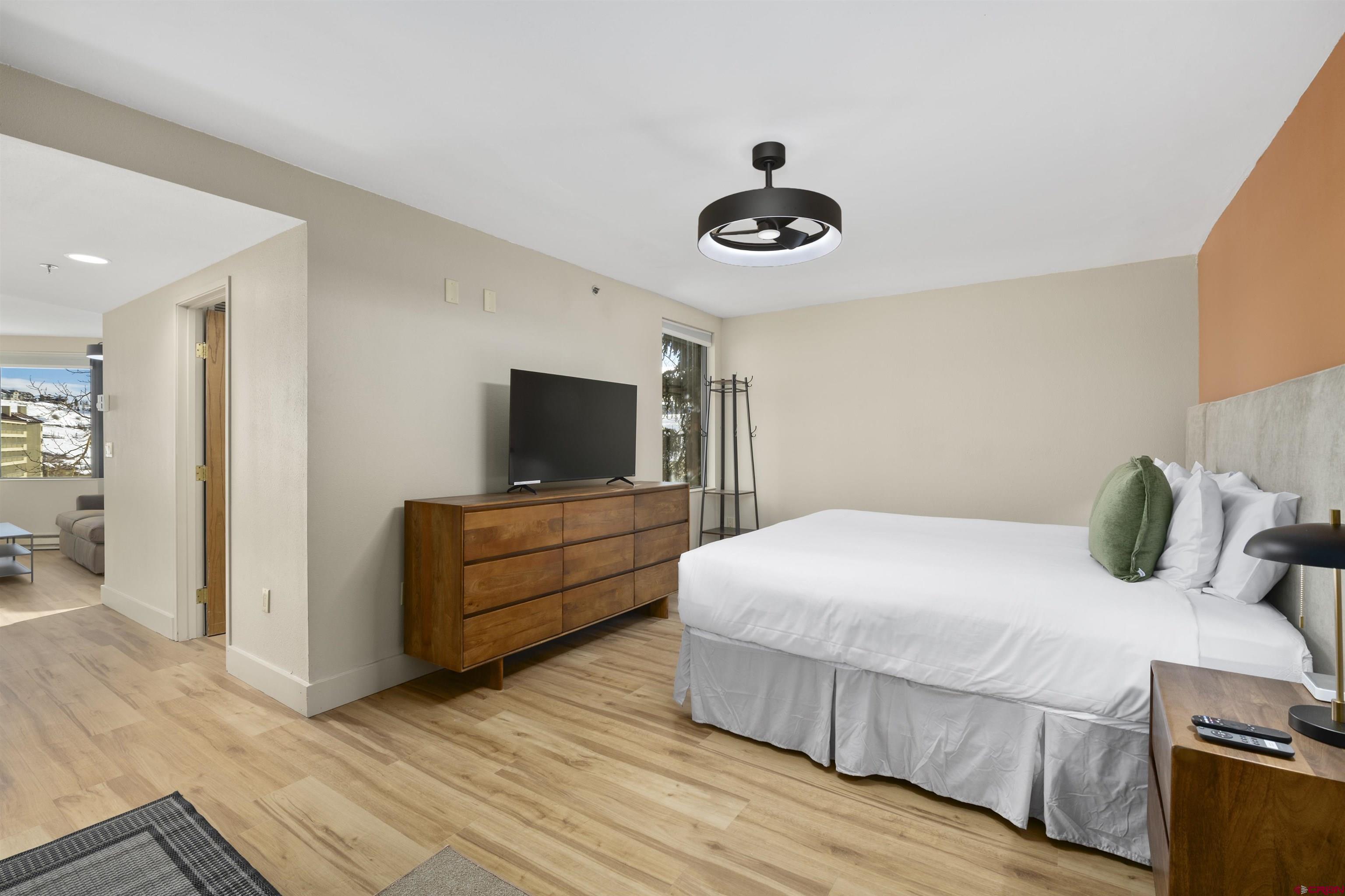 6 Emmons Road, Unit 351 Crested Butte, CO 81225 - Photo 15 of 21 a bedroom with a bed and a flat screen tv