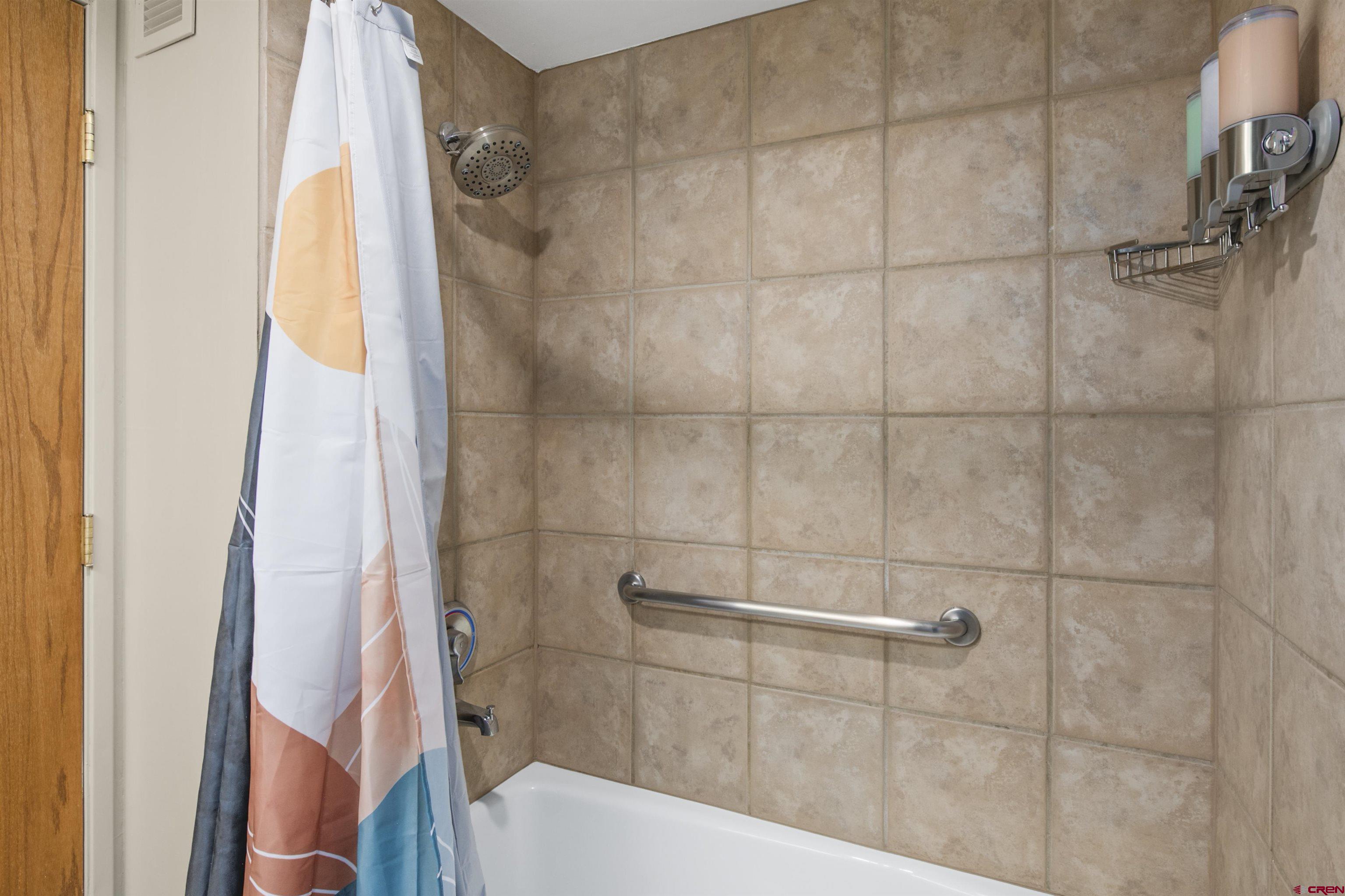 6 Emmons Road, Unit 351 Crested Butte, CO 81225 - Photo 18 of 21 a bathroom with a bathtub and shower