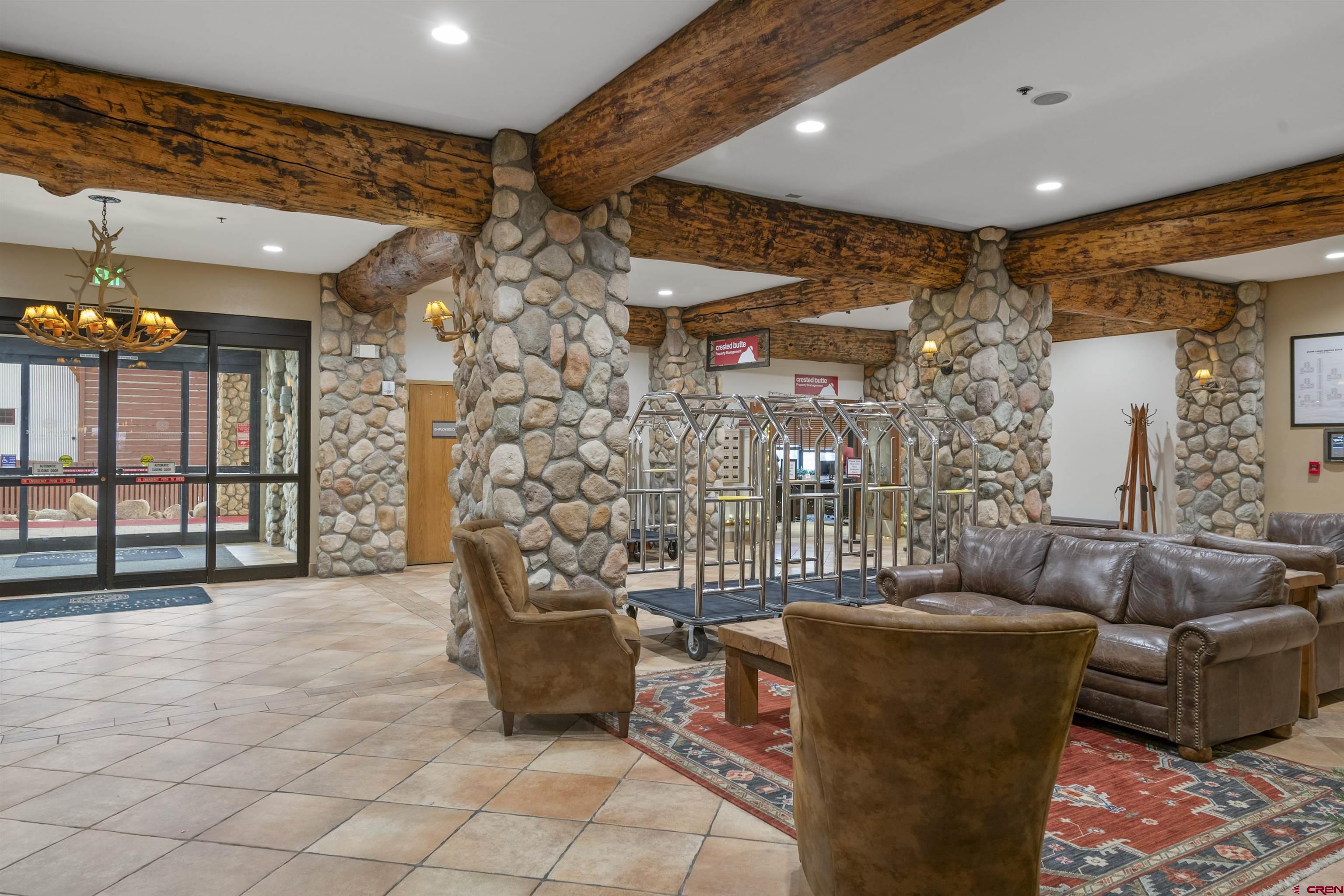 6 Emmons Road, Unit 351 Crested Butte, CO 81225 - Photo 21 of 21 a living room with furniture and a flat screen tv