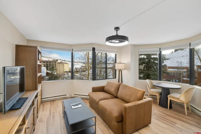 a living room with furniture and a large window