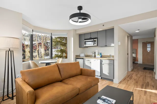 a living room with furniture and a large window