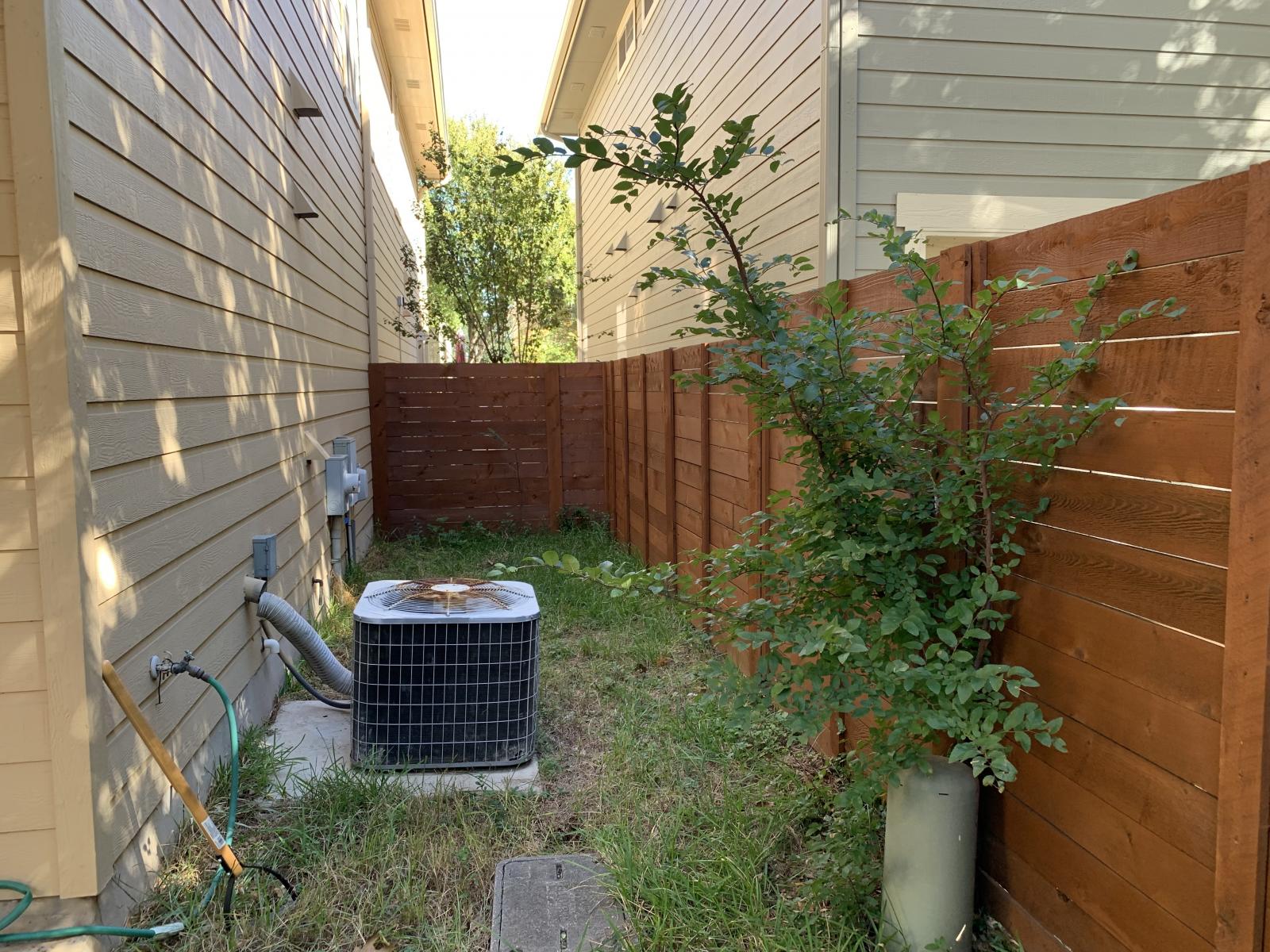 11000 Anderson Mill Road, Unit 29 Austin, TX 78750 - Photo 6 of 27 a backyard of a house with a garden