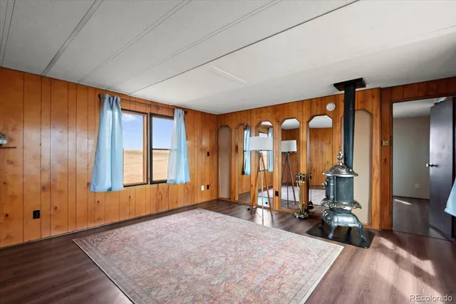 a view of a bedroom with furniture and windows