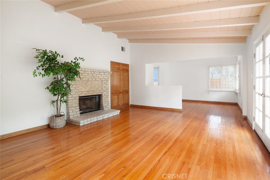 3734 Wrightwood Drive Studio City, CA 91604 - Photo 12 of 28 a view of a livingroom with wooden floor and a fireplace