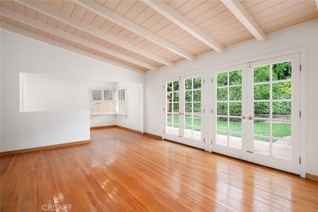 3734 Wrightwood Drive Studio City, CA 91604 - Photo 13 of 28 a view of an empty room with a window and wooden floor
