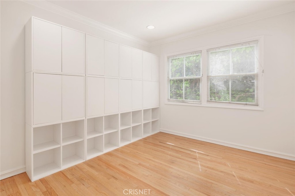 3734 Wrightwood Drive Studio City, CA 91604 - Photo 17 of 28 a view of an empty room with a window and wooden floor