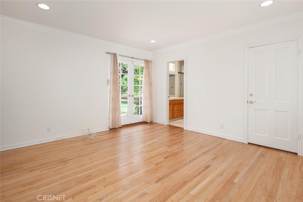 3734 Wrightwood Drive Studio City, CA 91604 - Photo 20 of 28 a view of an empty room with wooden floor and a window