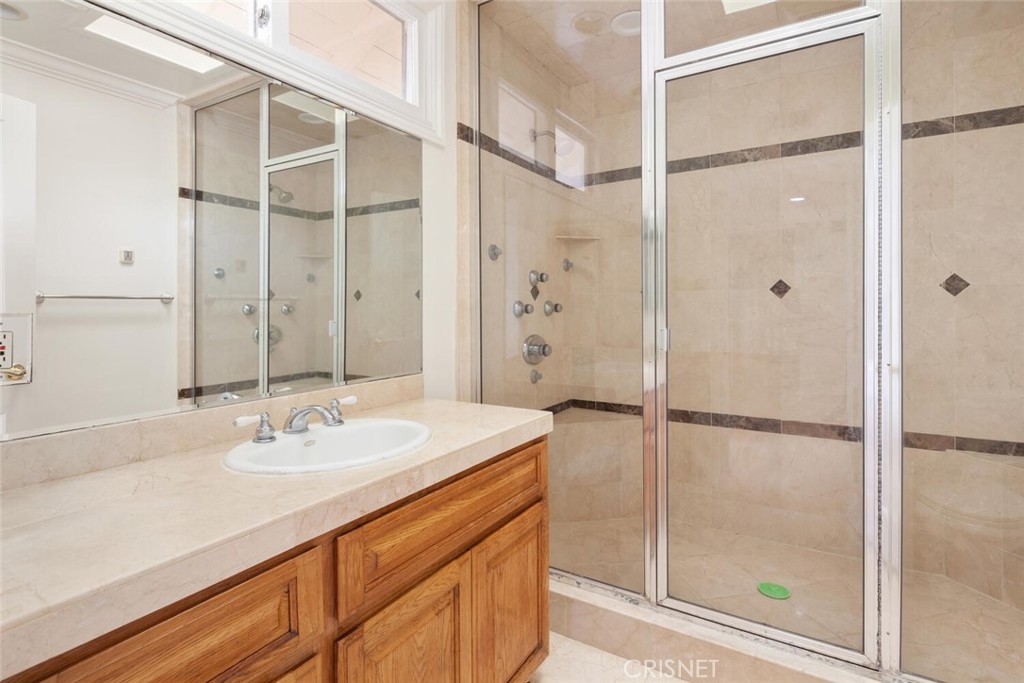 3734 Wrightwood Drive Studio City, CA 91604 - Photo 21 of 28 a bathroom with a shower sink and mirror